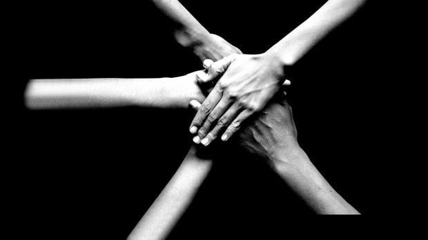 hands on black background