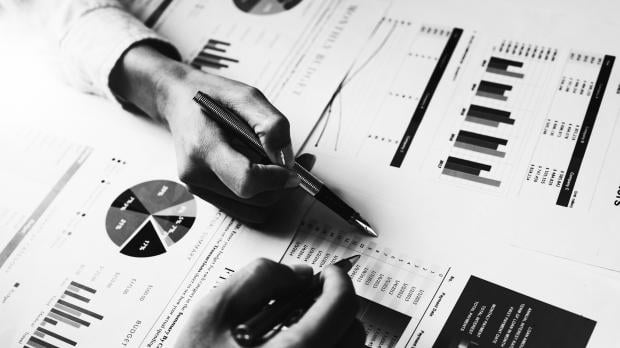 Team members looking at financial results data