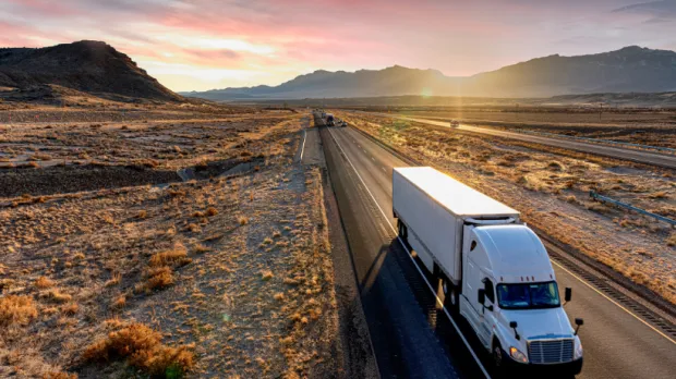 Commercial Auto Truck Truck driving down highway