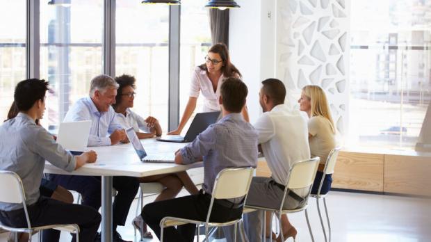 Businesswoman presenting to colleagues at a meeting